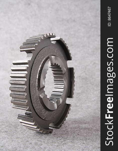 A steel gear isolated on gray background