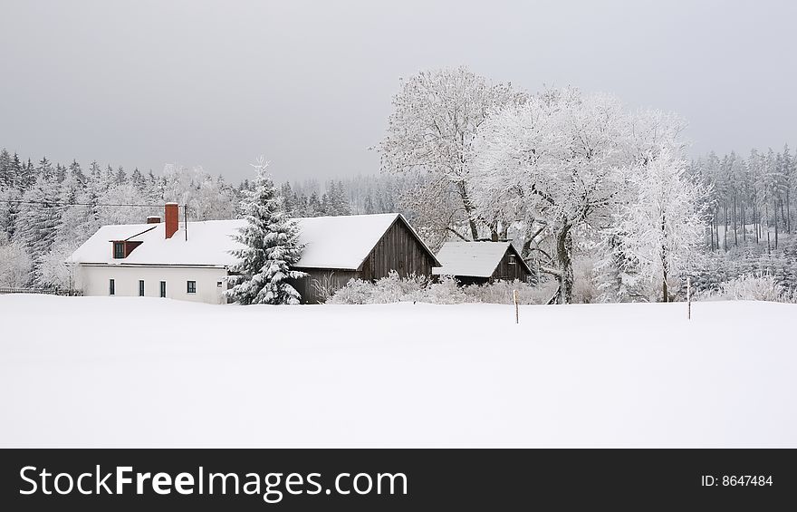 Lonely farm in the woods in winter. Lonely farm in the woods in winter