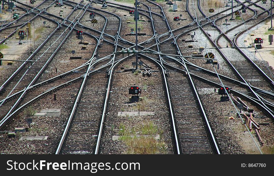 Railroad tracks and switches near a train staition