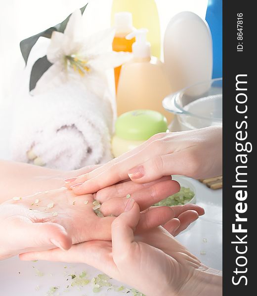 Spa process with female hands.