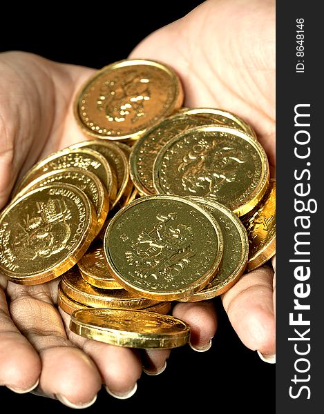 Gold coins on female hands