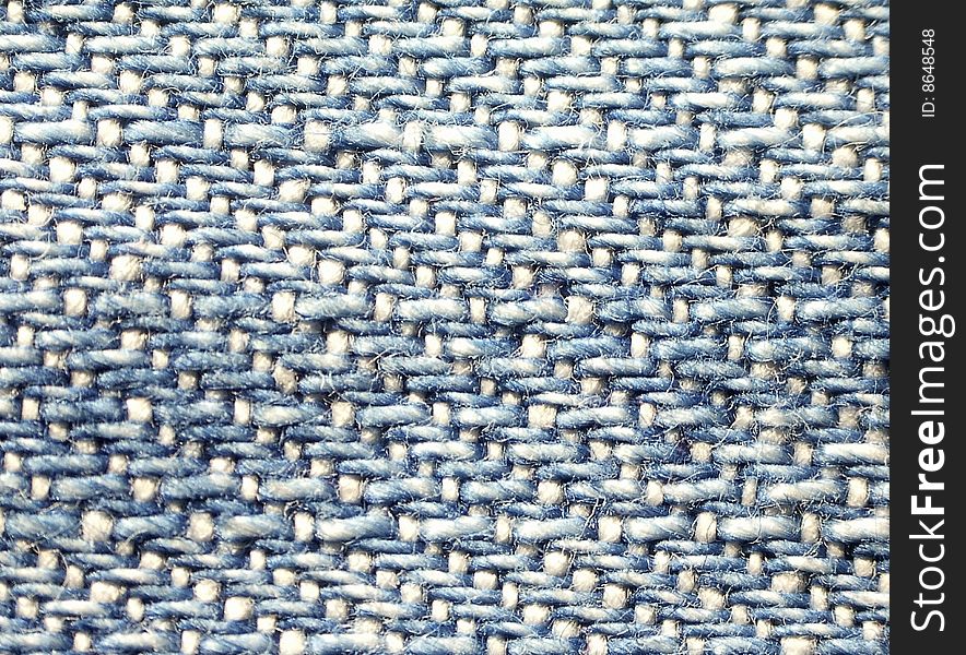 Macro of actual blue cotton denim fabric. Macro of actual blue cotton denim fabric.