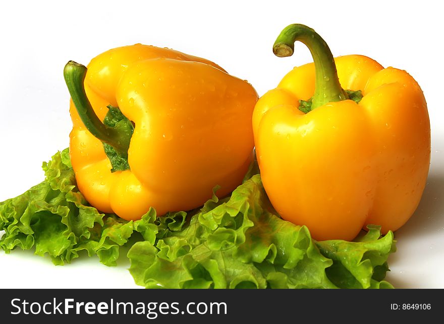 Yellow sweet pepper with lettuce isolated on white background