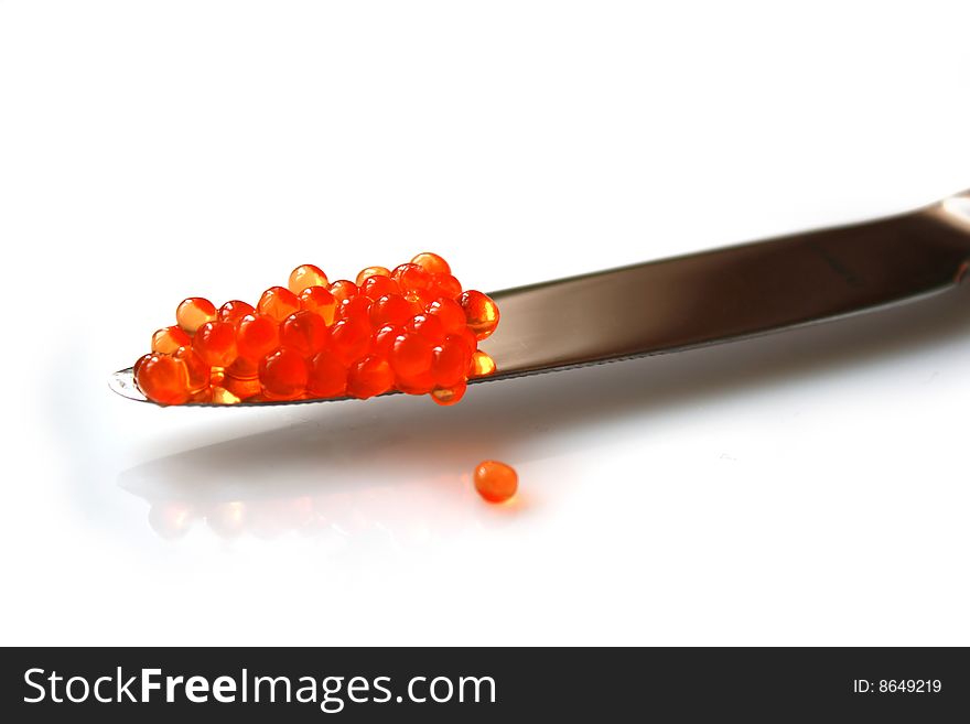 Delicious salmon red caviar and a knife