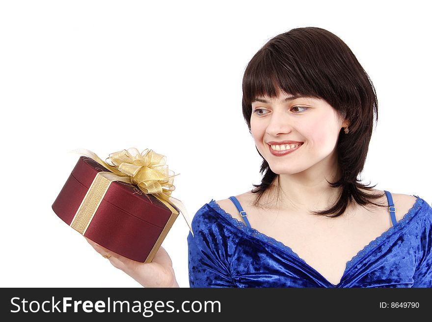 Beautiful smiling woman with a gift. Attractive girl holding purple box with gold ribbon. Isolated over white background. Happy girl is surprising at present. Beautiful smiling woman with a gift. Attractive girl holding purple box with gold ribbon. Isolated over white background. Happy girl is surprising at present.