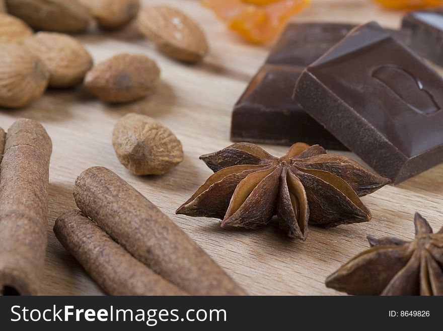 Close up of almonds, chocolate, cinnamon, anise. Close up of almonds, chocolate, cinnamon, anise