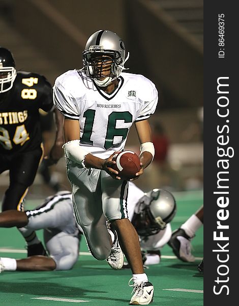 Man in White 16 Football Jersey While Playing Football