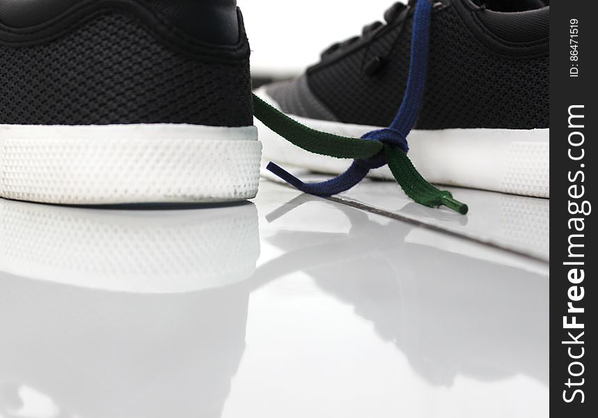 Close-up Of Shoes Against White Background