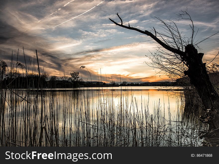 Scenic View of Lake Against Sky during Sunset