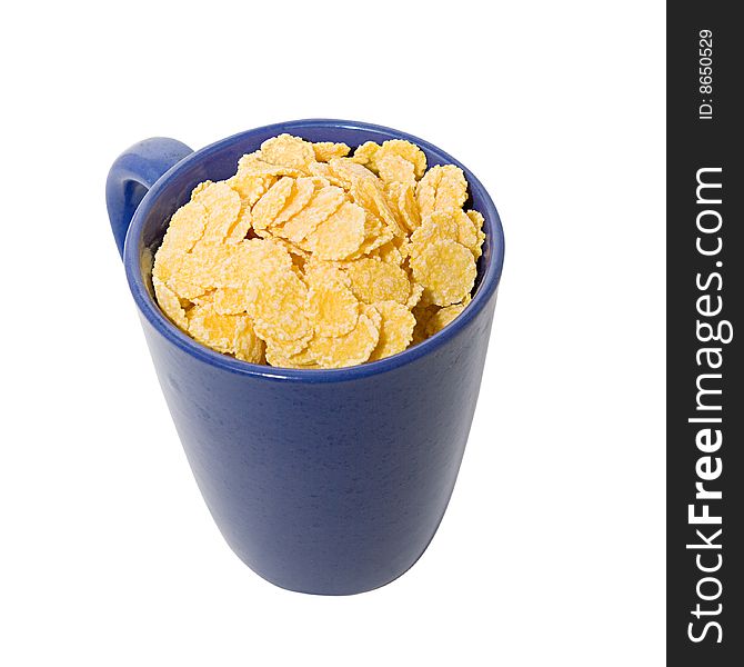 A cup full of cornflakes, view from above. A cup full of cornflakes, view from above