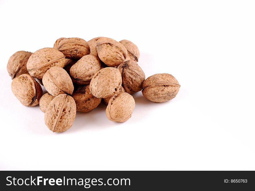 Walnut in an environment of other walnuts in various compositions.