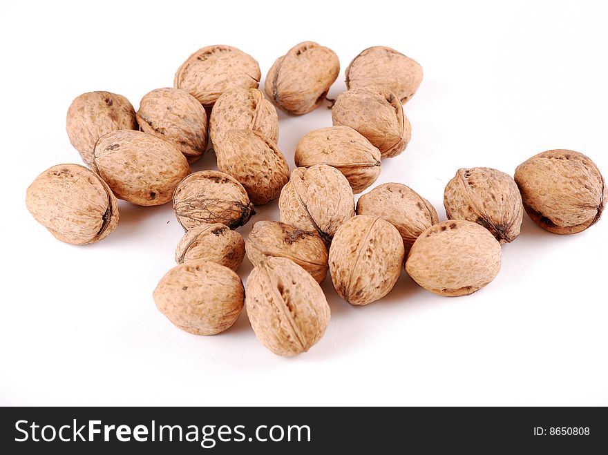 Walnut in an environment of other walnuts in various compositions.