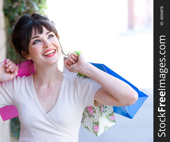 Attractive young woman out on the town shopping. Attractive young woman out on the town shopping