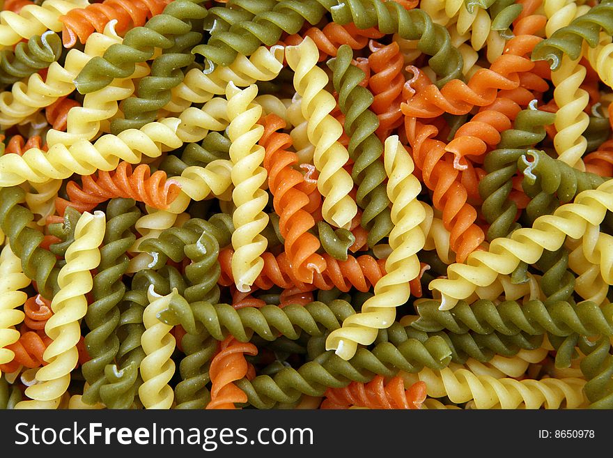 Various color spiral pasta background