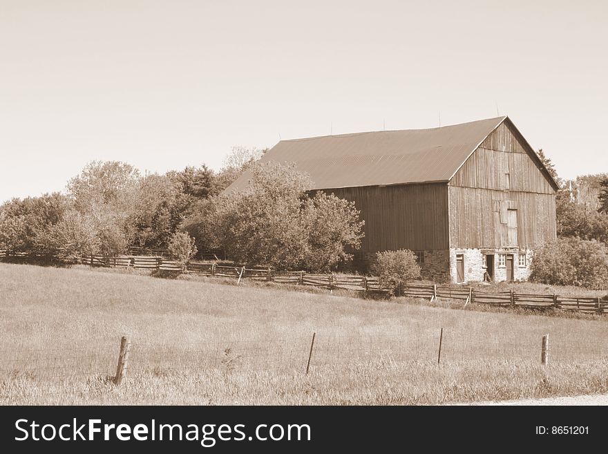 Looking over a field at a barn. Looking over a field at a barn.