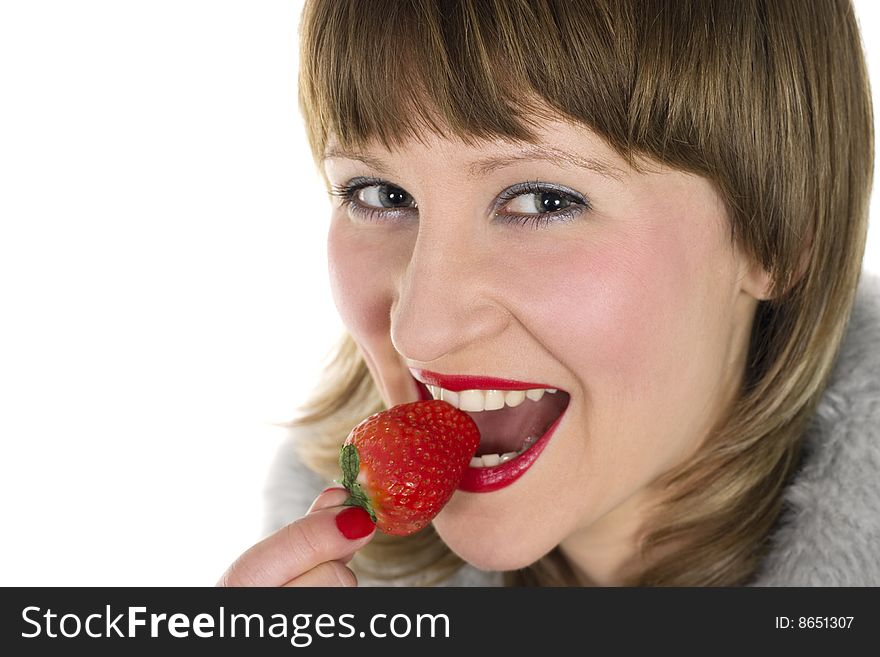 Young beauty woman eating fresh tasty strawberry. Young beauty woman eating fresh tasty strawberry