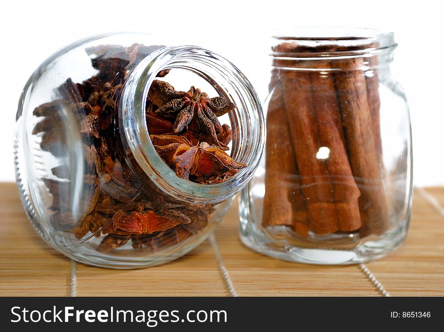 Cinnamon Stick and Anise Star in transparent container. Cinnamon Stick and Anise Star in transparent container