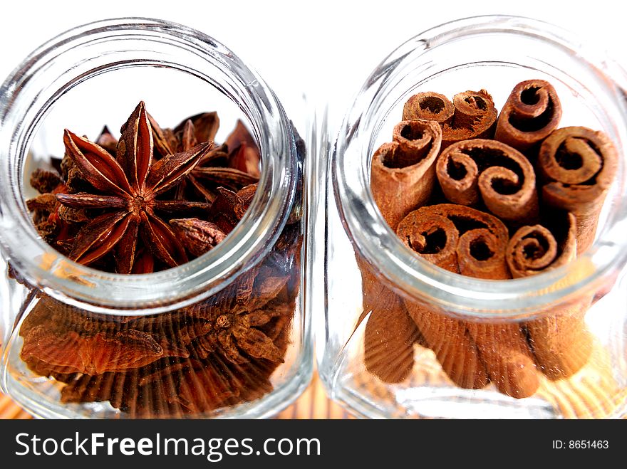 Cinnamon Stick and Anise Star in transparent container. Cinnamon Stick and Anise Star in transparent container