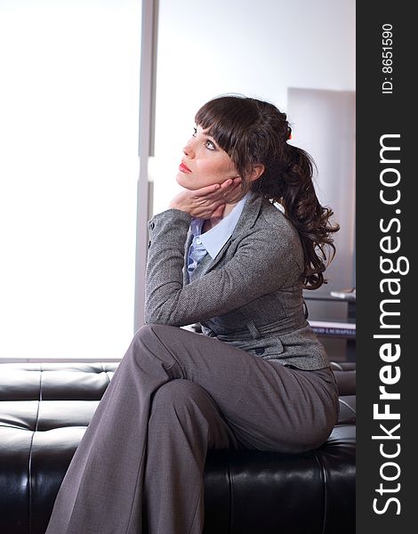 Business woman thinking in a modern office