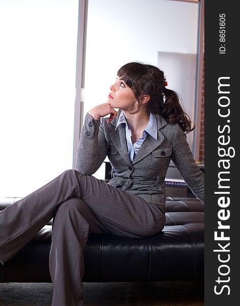 Business woman thinking in a modern office