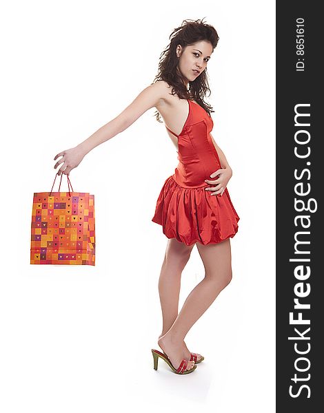 Young woman in red with shopping bags. Young woman in red with shopping bags