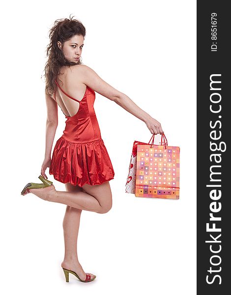 Young woman in red with shopping bags. Young woman in red with shopping bags