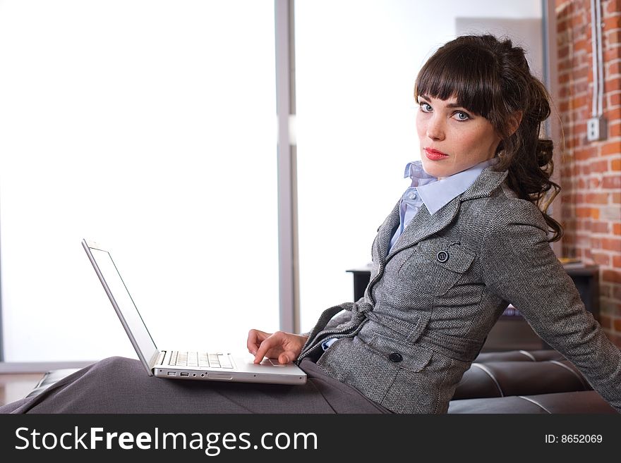 Business woman laptop in modern office. Business woman laptop in modern office