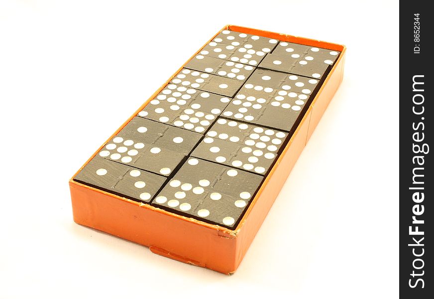 Box of dominoes isolated on a white background.