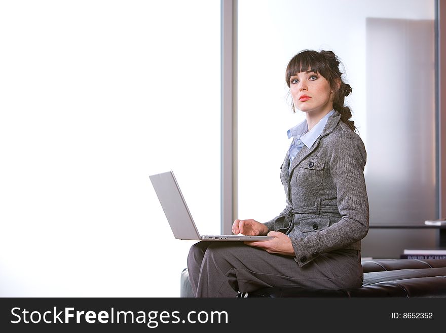 Business woman laptop in modern office. Business woman laptop in modern office