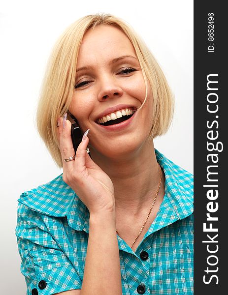 Blonde said by cell phone on a white background. Blonde said by cell phone on a white background