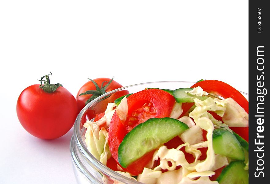 Fresh vegetable salad with tomato and cucumber isolated on white background