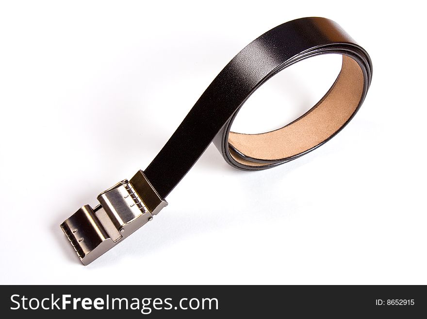A black  leather belt isolated on white background. A black  leather belt isolated on white background
