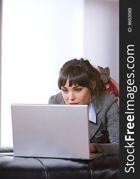 Business Woman on laptop in a modern loft office. Business Woman on laptop in a modern loft office