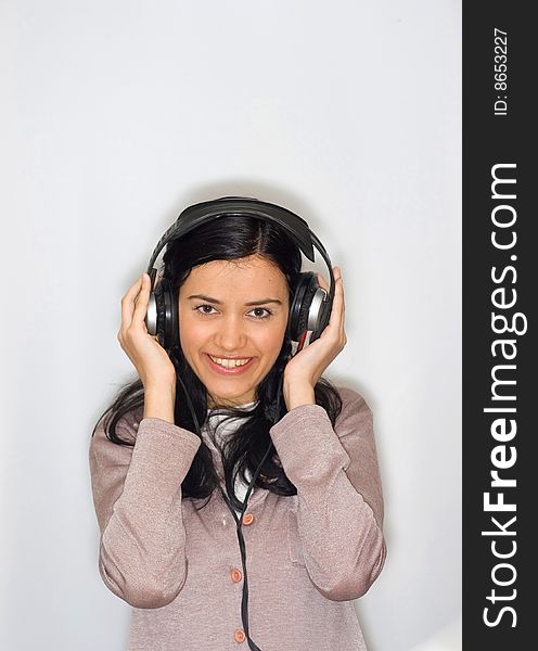 Young beautiful woman listening music