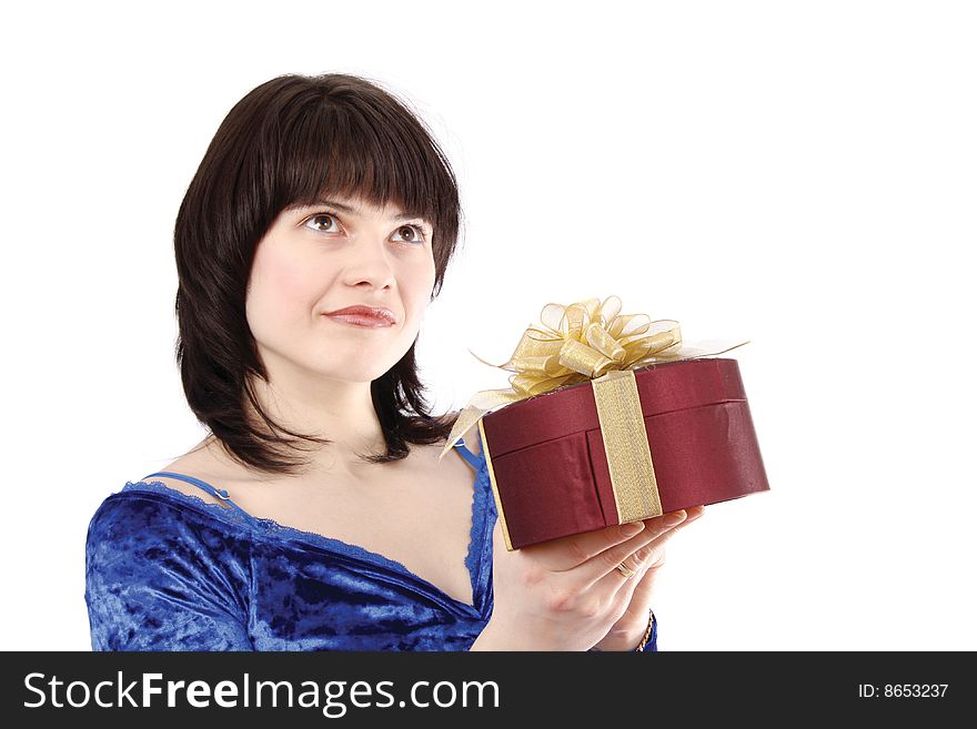 Beautiful smiling woman with a gift. Attractive girl holding purple box with gold ribbon. Isolated over white background Happy girl is surprising at present . Beautiful lady is thinking about something. Beautiful smiling woman with a gift. Attractive girl holding purple box with gold ribbon. Isolated over white background Happy girl is surprising at present . Beautiful lady is thinking about something.