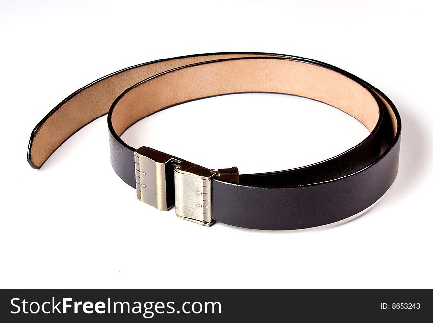 A black  leather belt isolated on white background. A black  leather belt isolated on white background