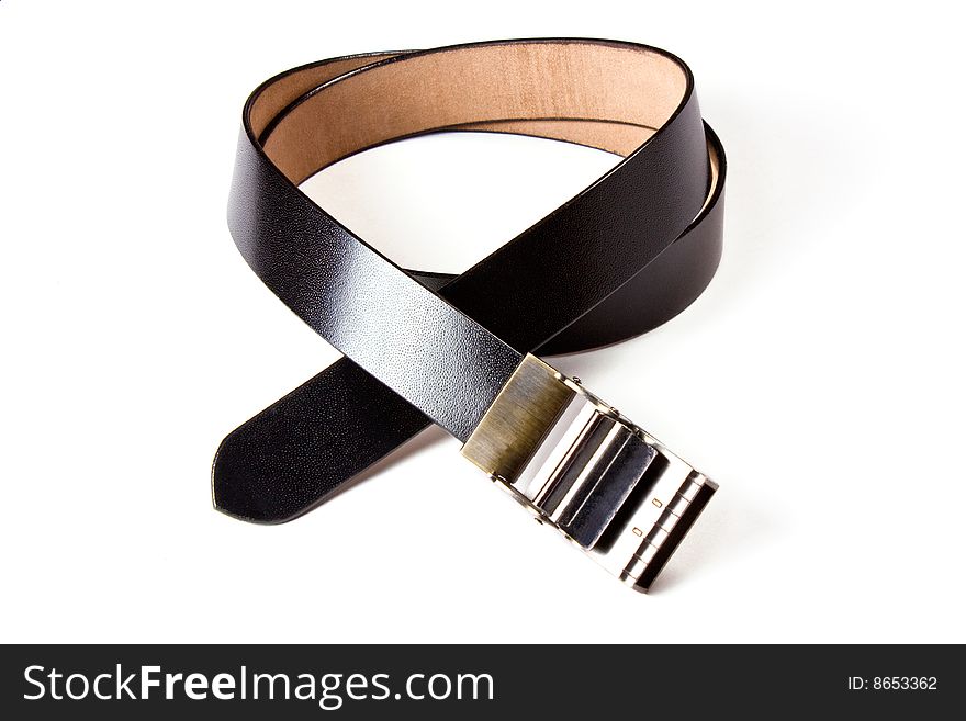 A black  leather belt isolated on white background. A black  leather belt isolated on white background