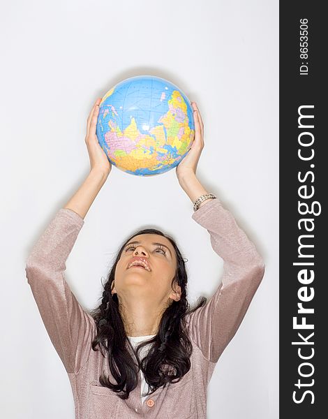 Young woman holding globe in her hands. Young woman holding globe in her hands