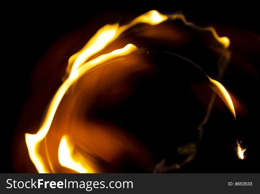 Abstract rings of fire on black background