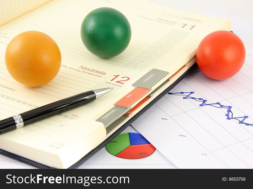 Colored, eggs, and business calendar plus calculator, pen and chart,. Colored, eggs, and business calendar plus calculator, pen and chart,