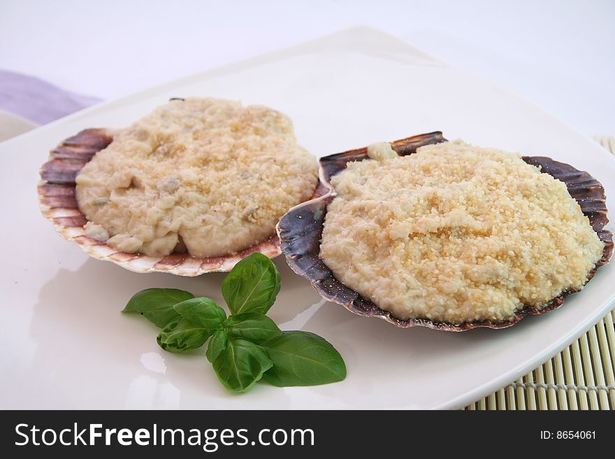 A meal of fresh mussels in decorative table ware