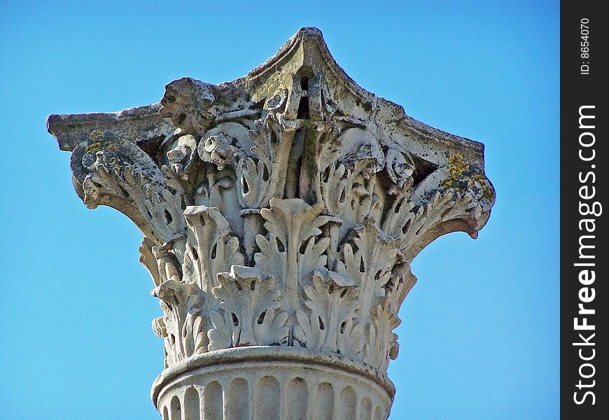 Corinthian column from Pompeii Italy isolated against a blue sky. Corinthian column from Pompeii Italy isolated against a blue sky.