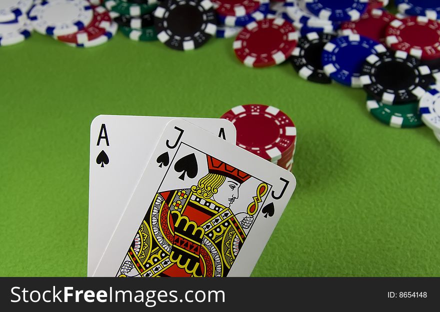 21 Ace and Jack spade over many casino chips. 21 Ace and Jack spade over many casino chips