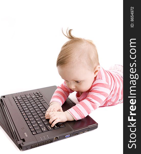 Little baby with laptop on white