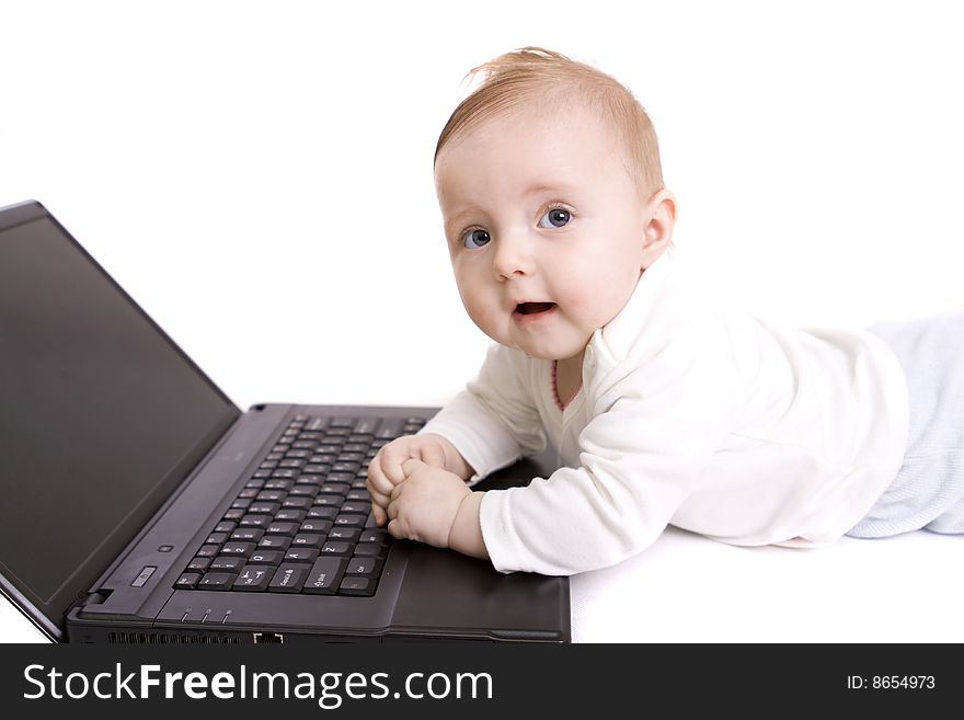 Little baby with laptop on white