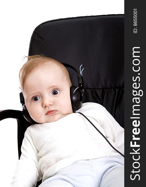 Baby with headphones on white