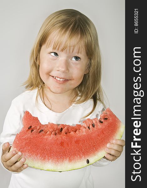 Picture of young girl and a slice of watermelon. Picture of young girl and a slice of watermelon