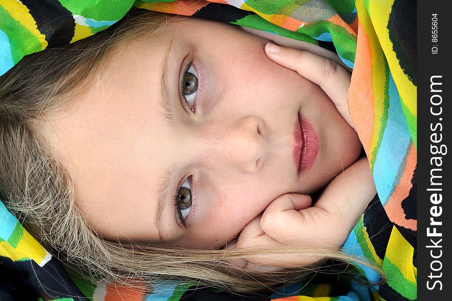 Pensive girl with exotic scarf