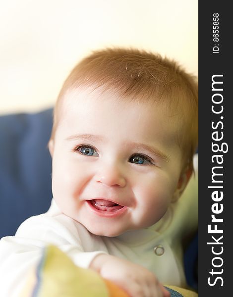 Portrait of joyful blue-eyes baby. Face close-up