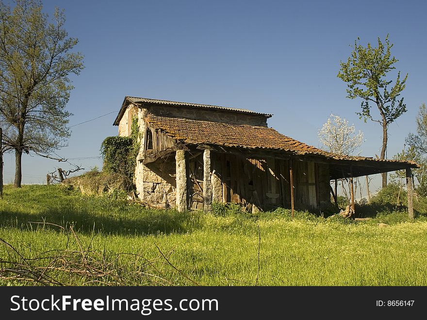 Old rural cabin during spring on a meadow. Old rural cabin during spring on a meadow